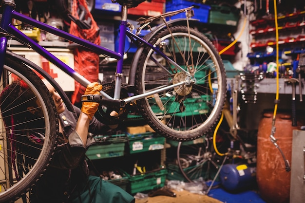 Mechanic repairing a bicycle