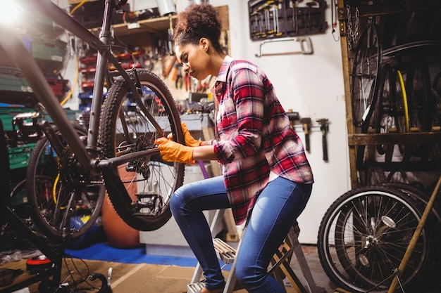 Mechanic repairing a bicycle