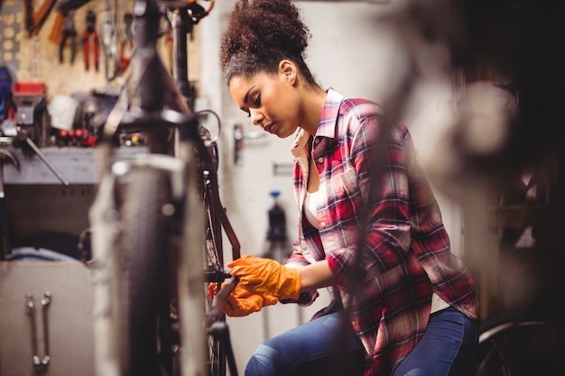 Mechanic repairing a bicycle