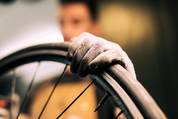 Free photo mechanic repairing a bicycle