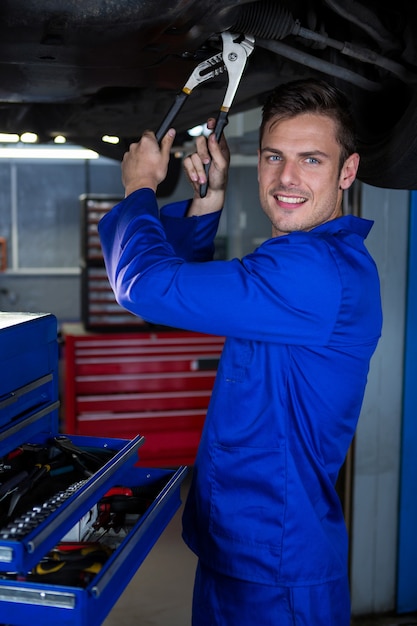 Mechanic servicing a car