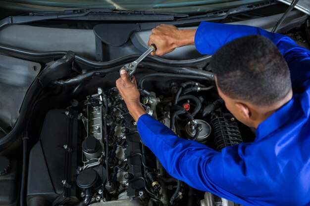 Mechanic servicing a car