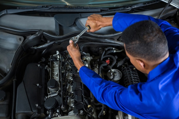 Mechanic servicing a car