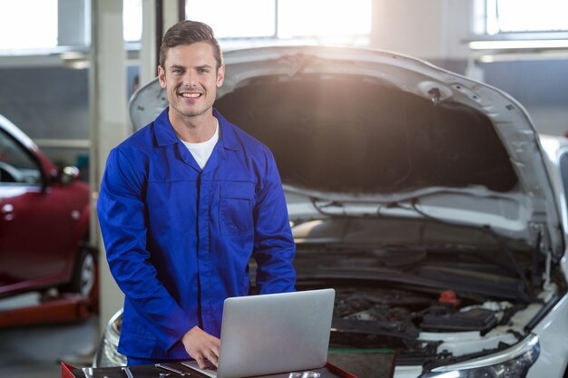 Mechanic using laptop