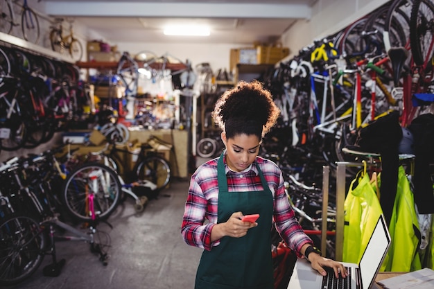 Mechanic using mobile phone