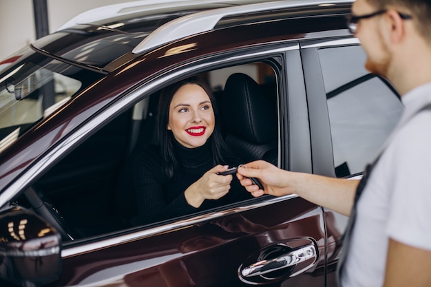 Mechanic with client in car service station