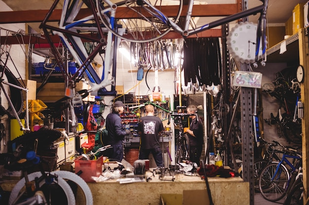 Mechanics servicing bicycles