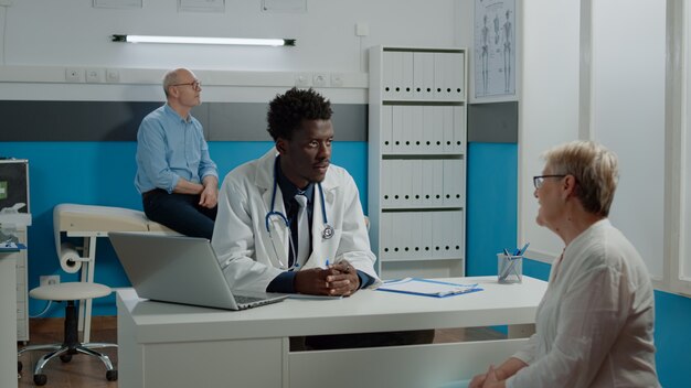 Medic of african american ethnicity doing examination