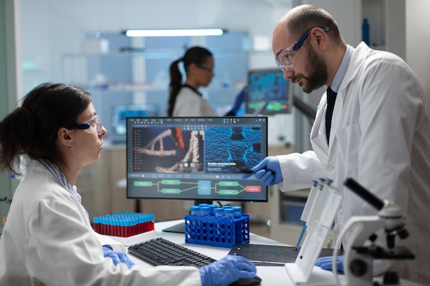 Medical biologist team working in microbiology hospital laboratory