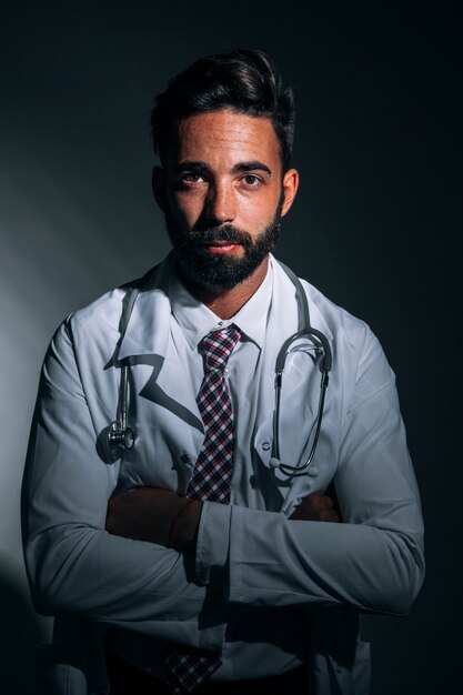 Medical doctor posing in the darkness