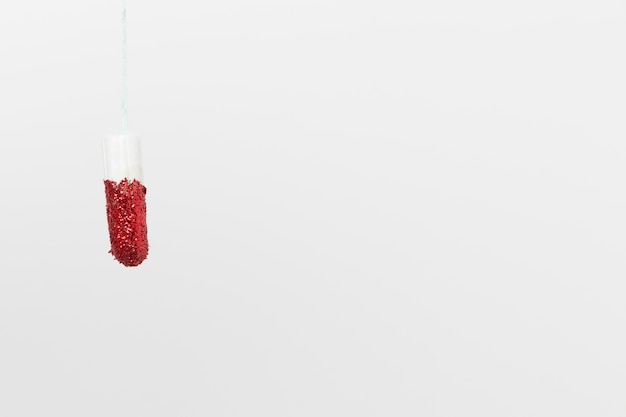 Free photo medical female tampon on a plain background