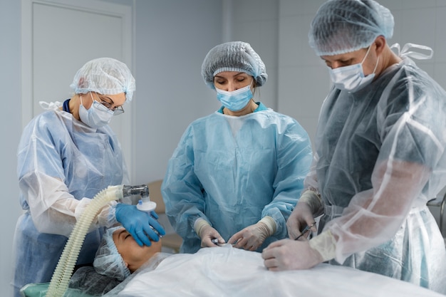 Medical team with the patient on the operator room