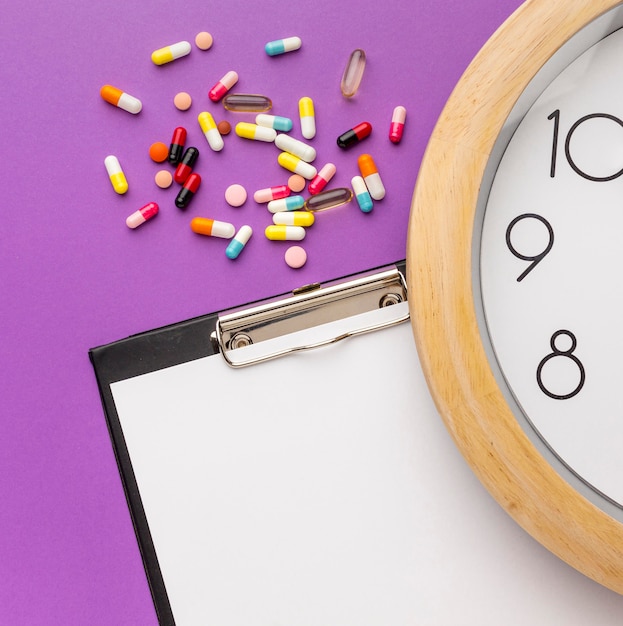 Free photo medication time with clipboard on desk