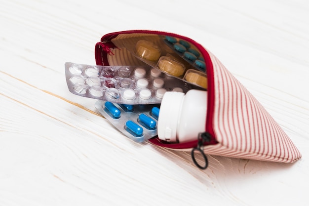 Free Photo medicine concept with pills in small bag