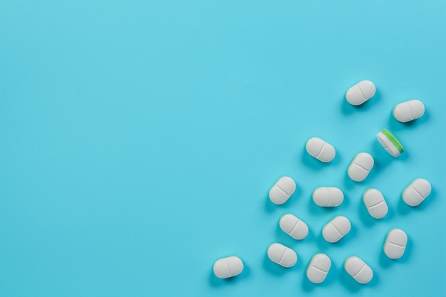 Free photo of medicines, medical supplies placed on a blue  .