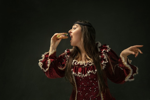 Medieval young woman in oldfashioned costume