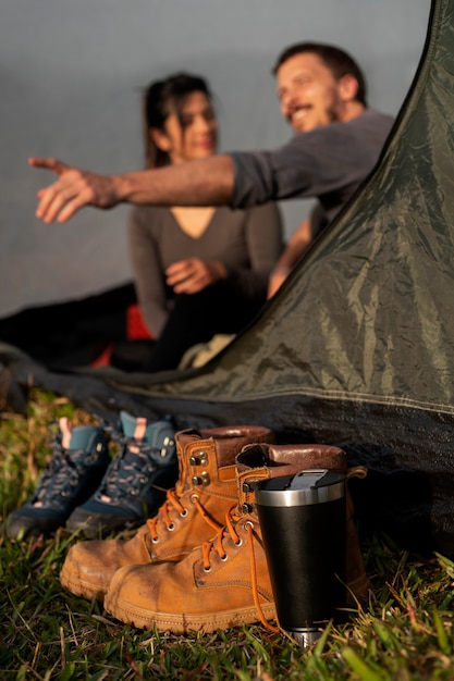 Free photo medium shot adventurous couple bivouacking