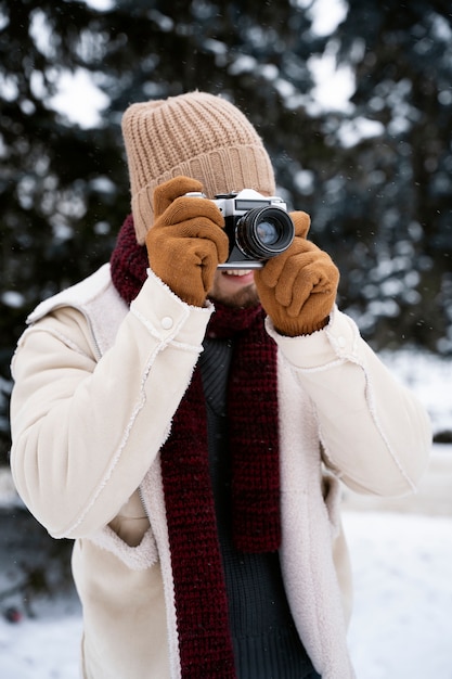 Medium shot artist taking photos