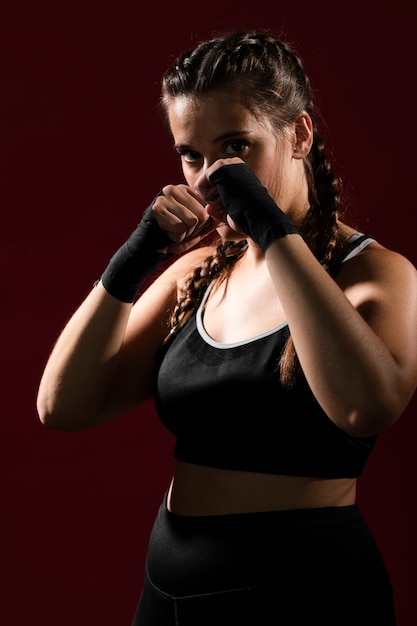 Medium shot of athletic woman in fitness clothes