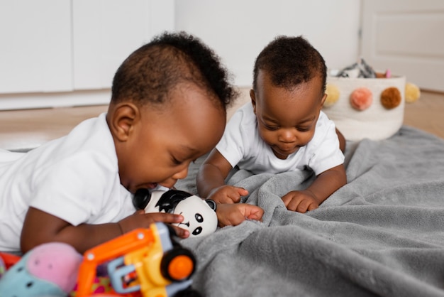 Medium shot babies laying in bed