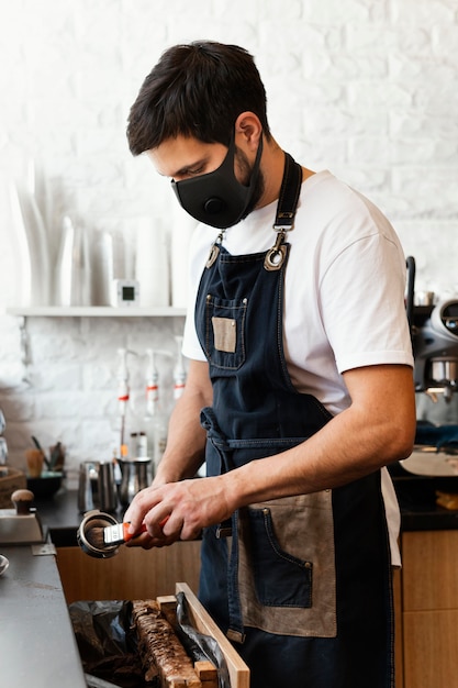 Medium shot barista preparing coffee