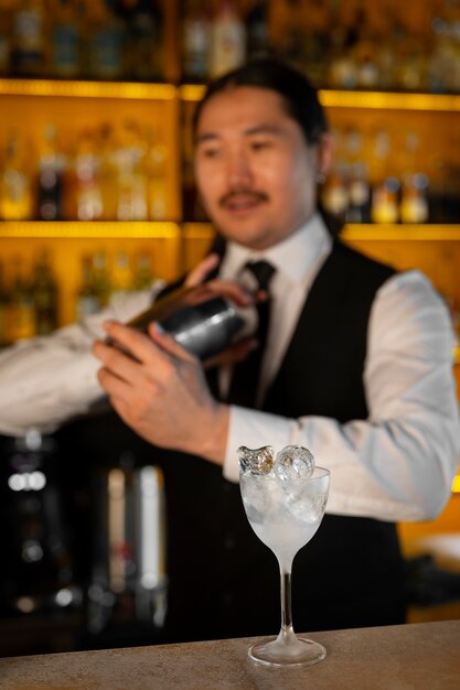 Medium shot bartender preparing drink