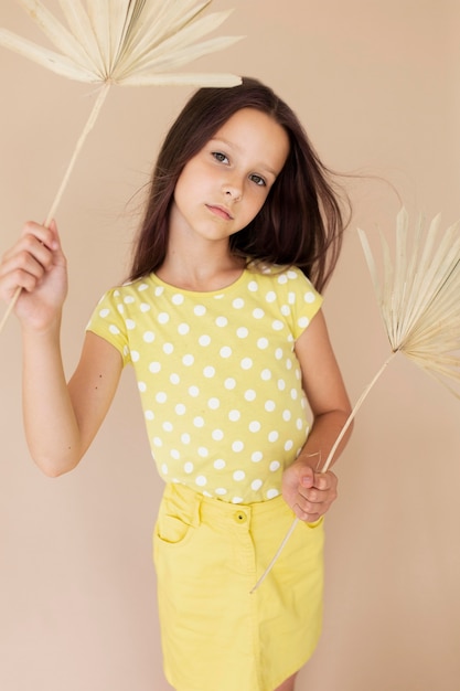 Medium shot beautiful girl posing with items