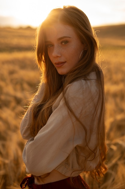 Medium shot beautiful woman posing outdoors