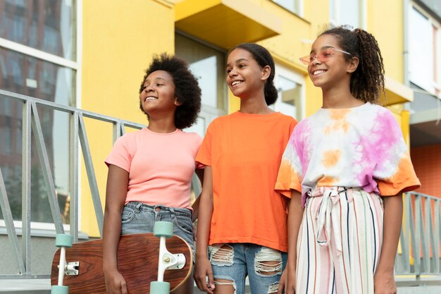 Medium shot black girls outdoors