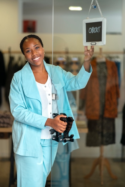 Free Photo medium shot black woman running a small business