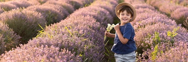 Medium shot boy in flower field