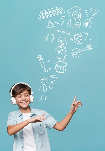 Free Photo medium shot boy wearing headphones