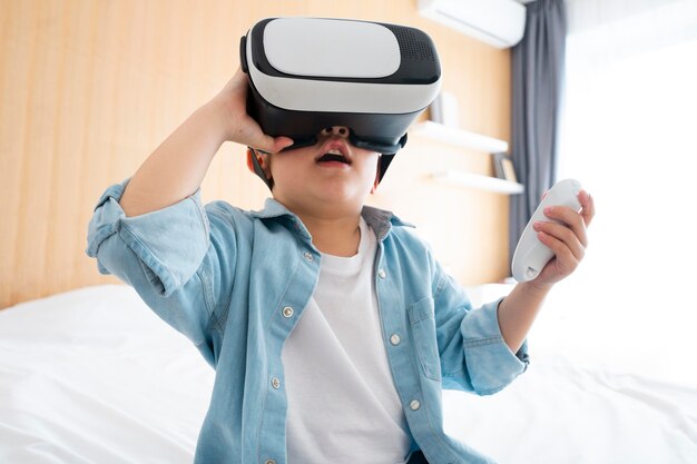 Medium shot boy with vr glasses