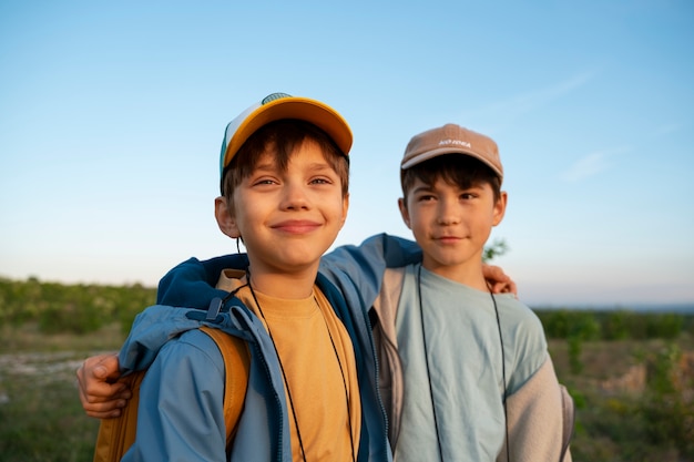 Medium shot boys exploring nature