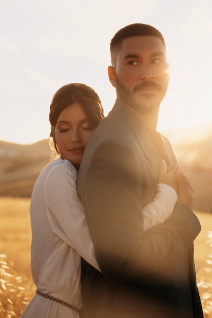 Free photo medium shot bride holding groom