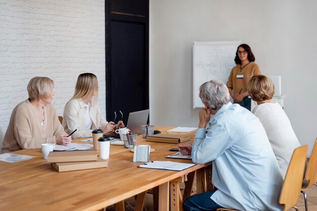 Medium shot business people in meeting