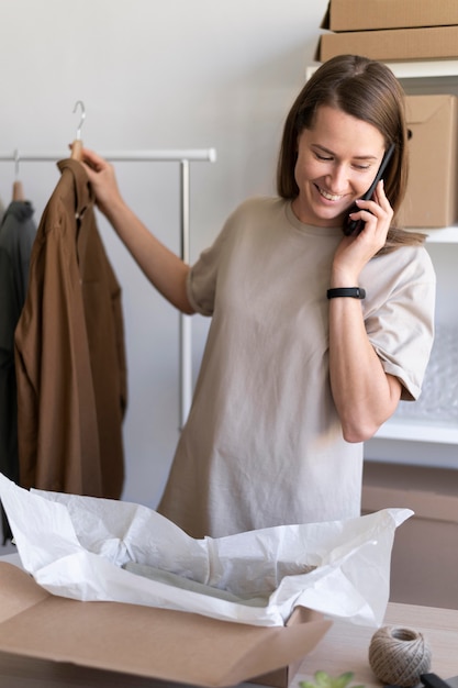 Medium shot businesswoman with phone