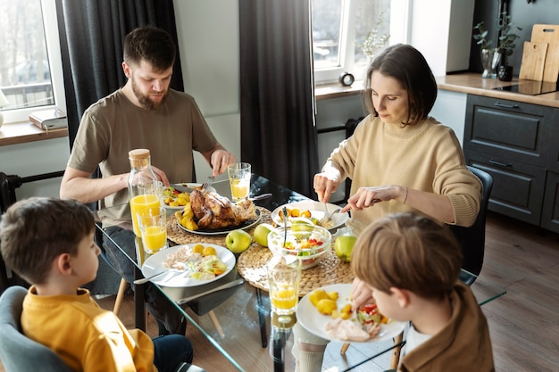 Medium shot christian family eating together