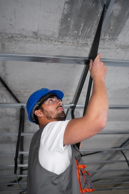 Free Photo medium shot construction worker doing his job