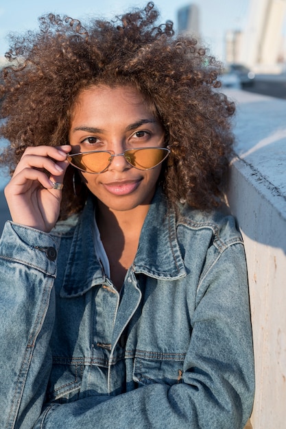 Free photo medium shot cool girl posing