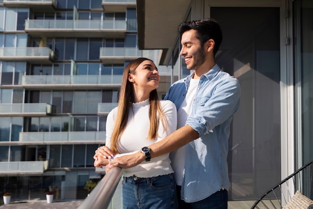 Medium shot couple buying new home