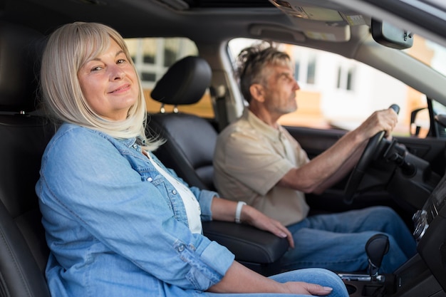 Medium shot couple in car