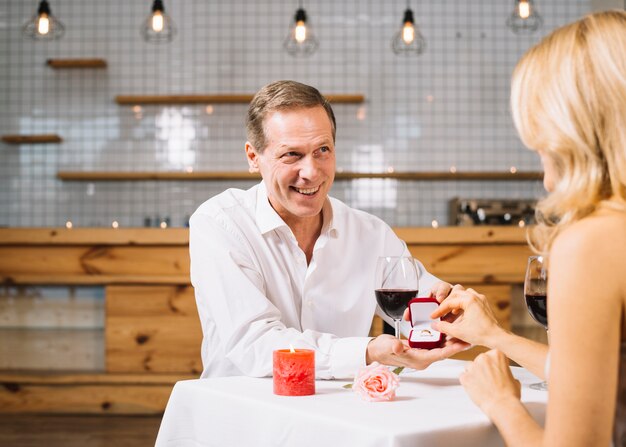 Medium shot of couple getting engaged