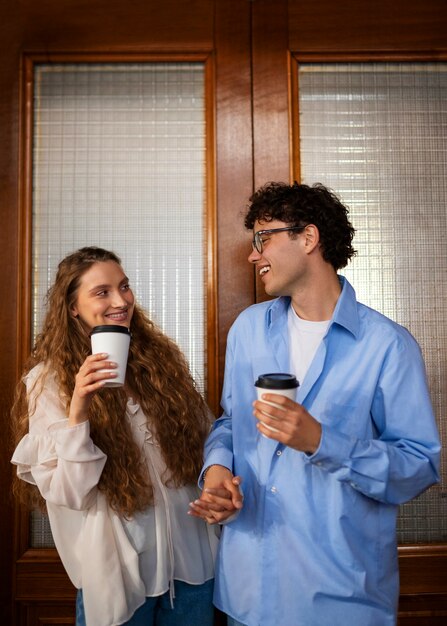 Medium shot couple having a bookstore date