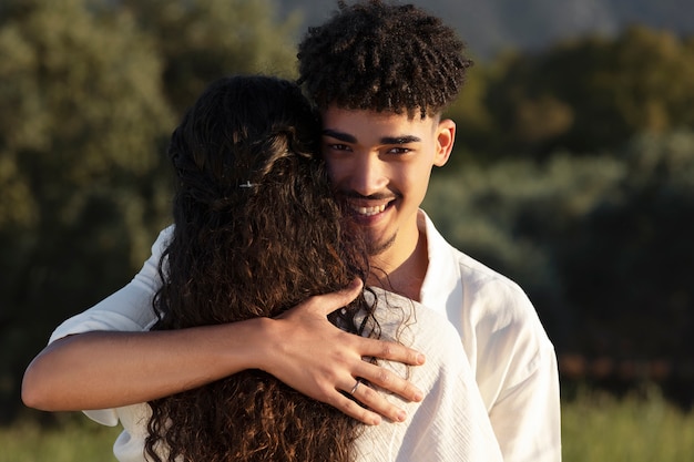 Medium shot couple hugging