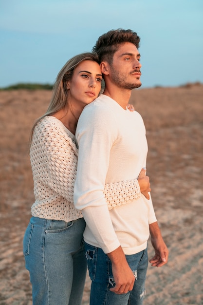 Free photo medium shot of couple looking away