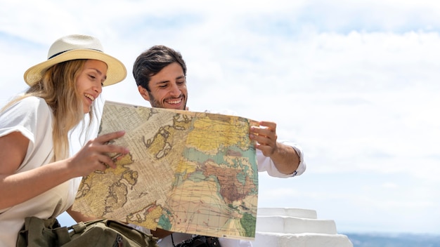 Free Photo medium shot couple looking at map