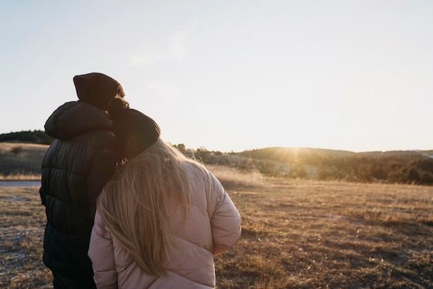 Medium shot couple in nature