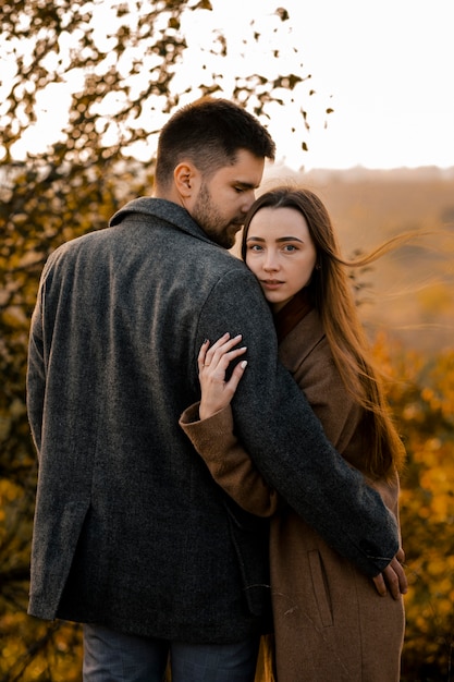 Free photo medium shot couple posing outdoors