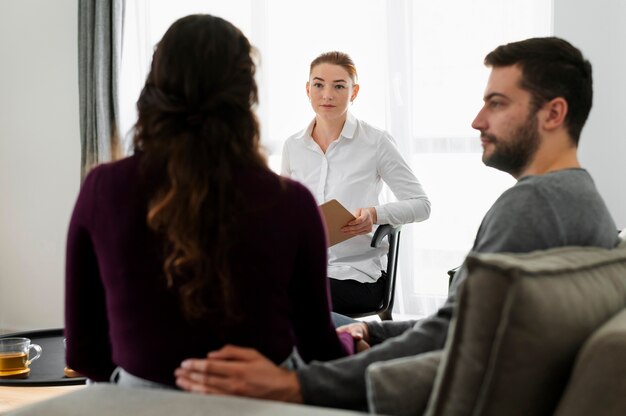 Medium shot couple at therapy